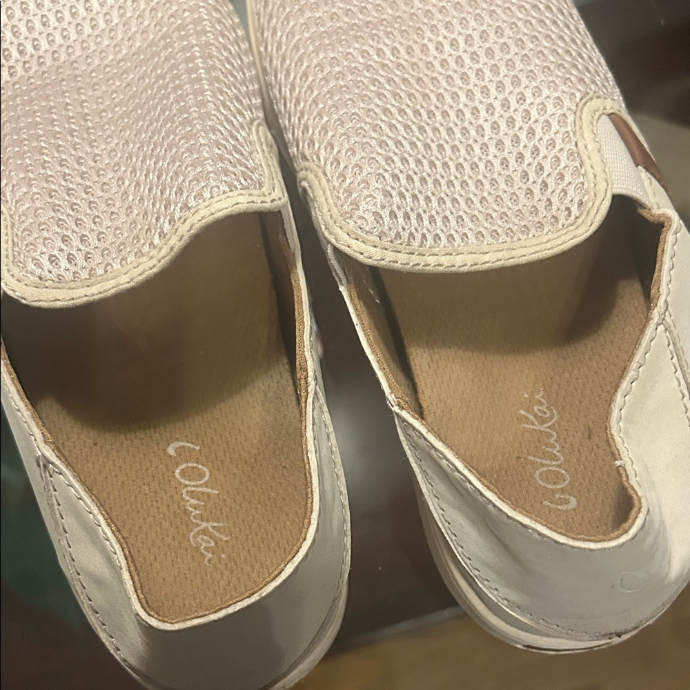 OluKai Women's tan and white slip on shoes. Very comfortable insole. EUC